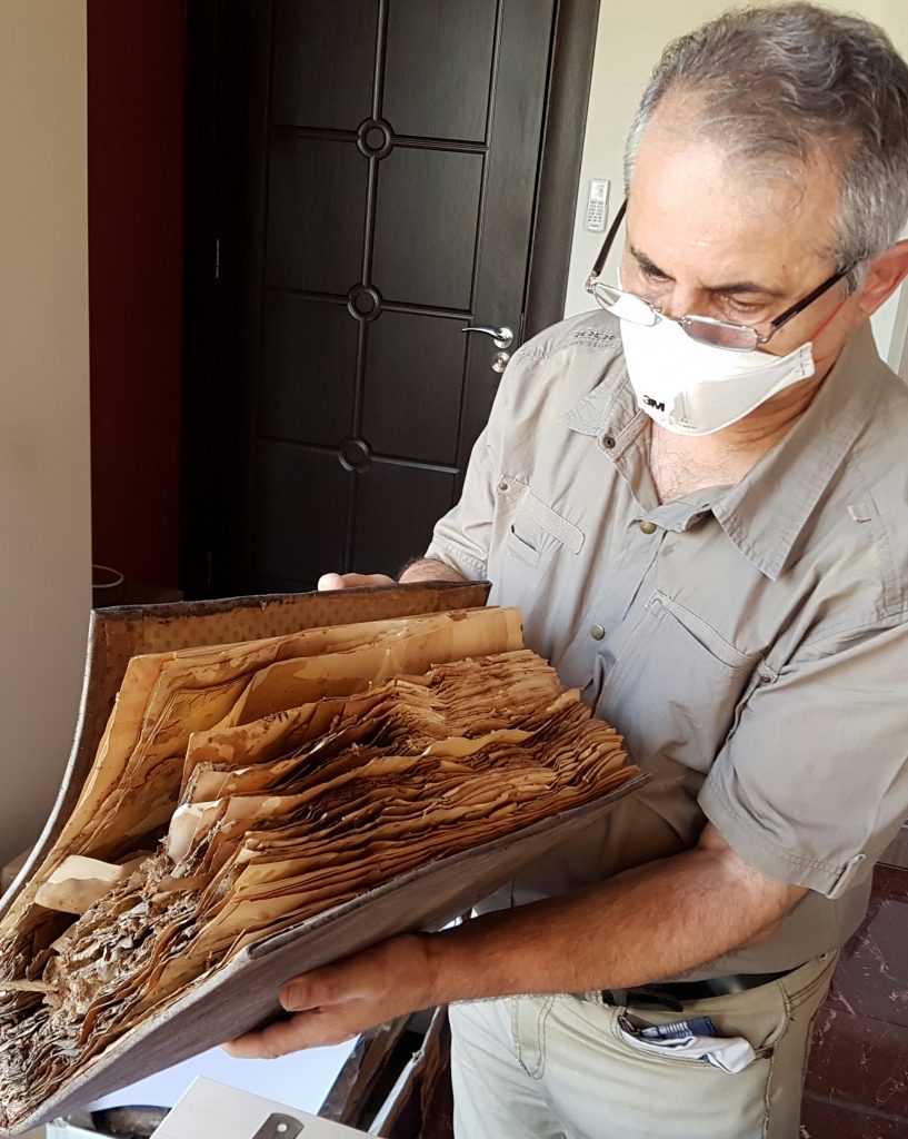 Fr. Najeeb Michaeel with manuscript at CNMO